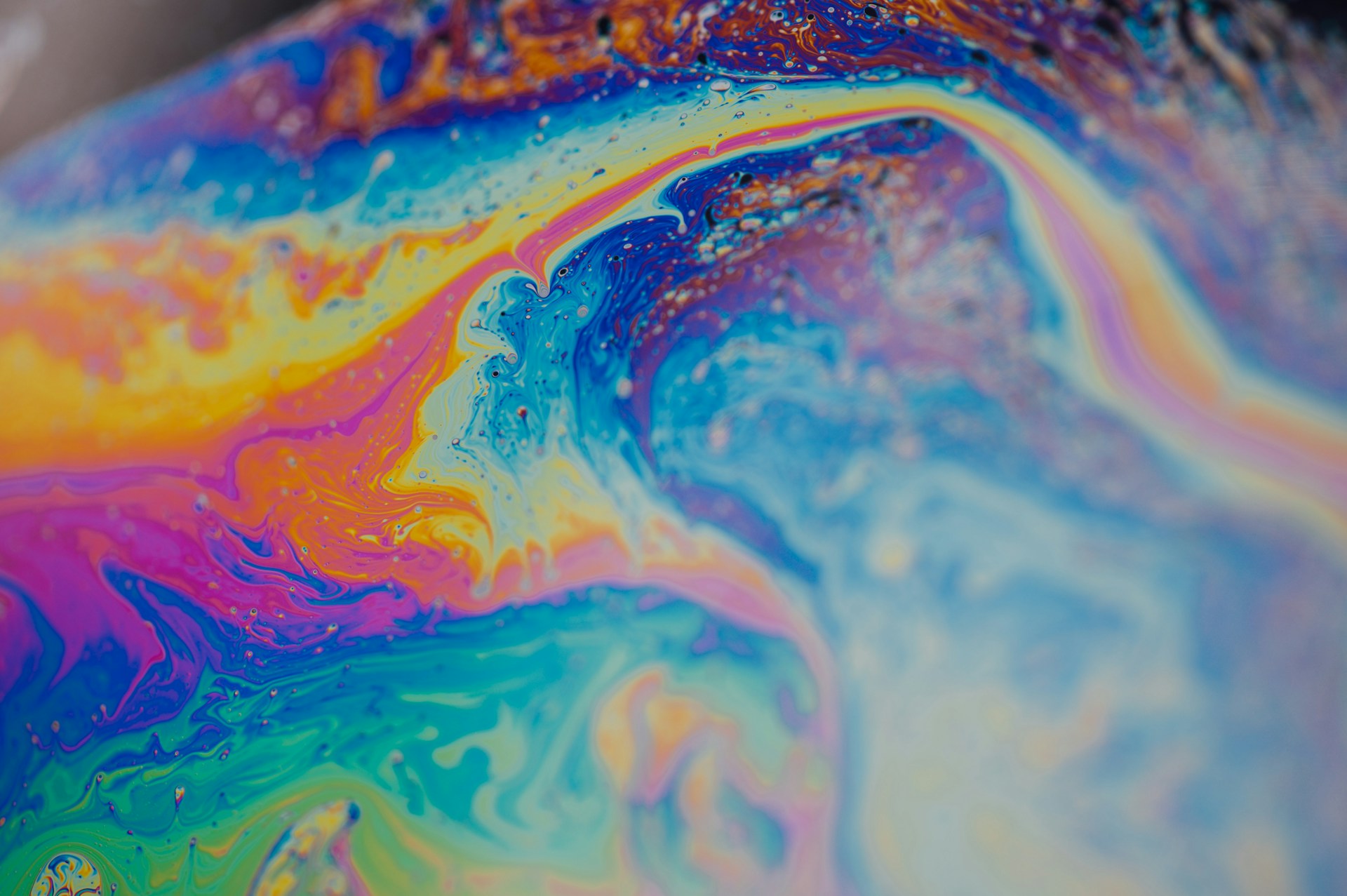 Fizzyble Valentine's Day bath bomb collection — colorful bath bombs arranged on a pink background